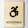 ADA braille 3D printed to wood, showing that an area is handicap "accessible"