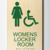ADA compliant wood sign showing "womens locker room"