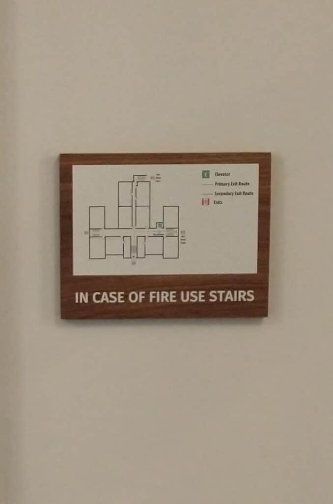 walnut wood sign with evacuation map